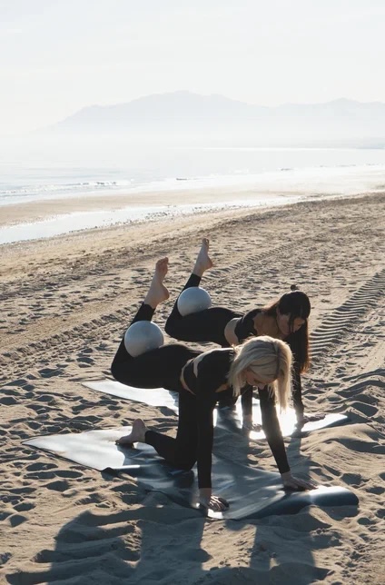 Pilates movement on the beach